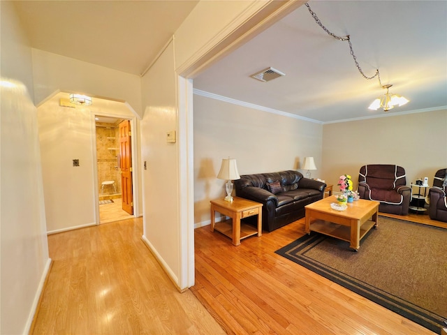 945 Swinton Ave, Bronx, NY 10465 - living area with light wood-type flooring, arched walkways, ornamental molding, and a chandelier