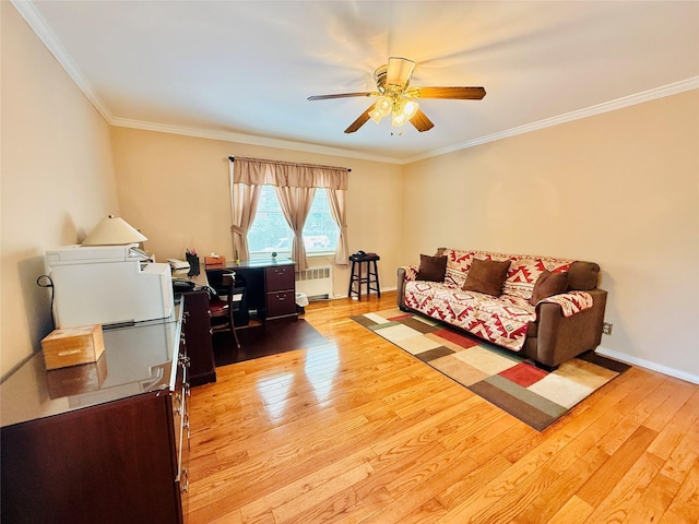 945 Swinton Ave, Bronx, NY 10465 - living room featuring radiator, ceiling fan, light wood-type flooring, ornamental molding, and a desk
