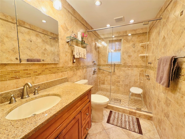 945 Swinton Ave, Bronx, NY 10465 - bathroom with tile walls, a stall shower, vanity, tile patterned flooring, and recessed lighting