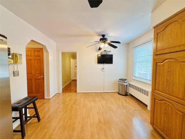 945 Swinton Ave, Bronx, NY 10465 - interior space with radiator heating unit, light wood-type flooring, and a ceiling fan