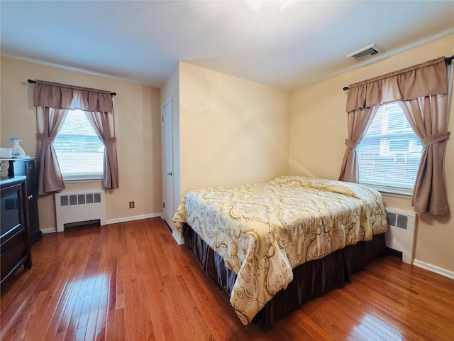 945 Swinton Ave, Bronx, NY 10465 - bedroom featuring radiator and hardwood / wood-style floors