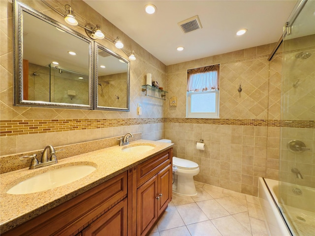 945 Swinton Ave, Bronx, NY 10465 - full bathroom featuring tile walls, double vanity, tile patterned flooring, bathing tub / shower combination, and recessed lighting