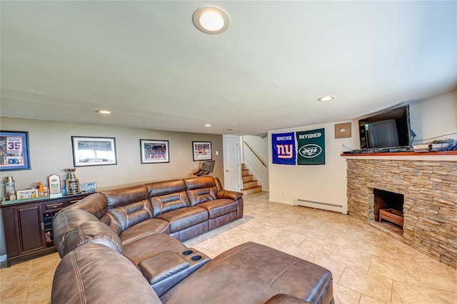 17 Abbott St, West Babylon, NY 11704 - living area featuring a baseboard heating unit, a bar, stairs, a stone fireplace, and light tile patterned flooring