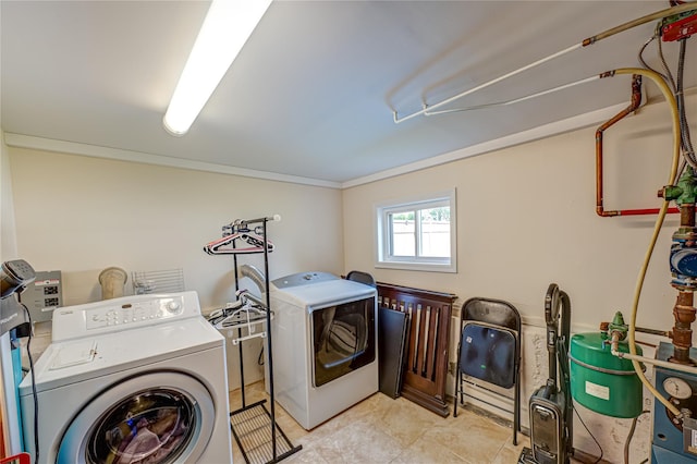 17 Abbott St, West Babylon, NY 11704 - laundry area featuring separate washer and dryer and crown molding