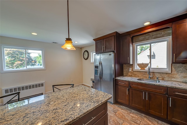 17 Abbott St, West Babylon, NY 11704 - kitchen with stainless steel fridge, radiator, plenty of natural light, decorative backsplash, and recessed lighting
