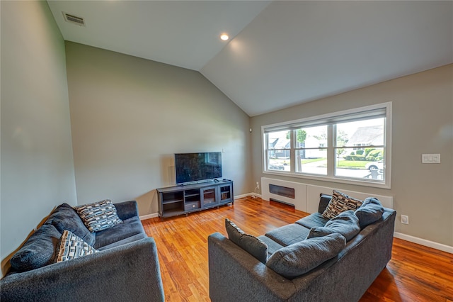 17 Abbott St, West Babylon, NY 11704 - living room with lofted ceiling, wood finished floors, and recessed lighting