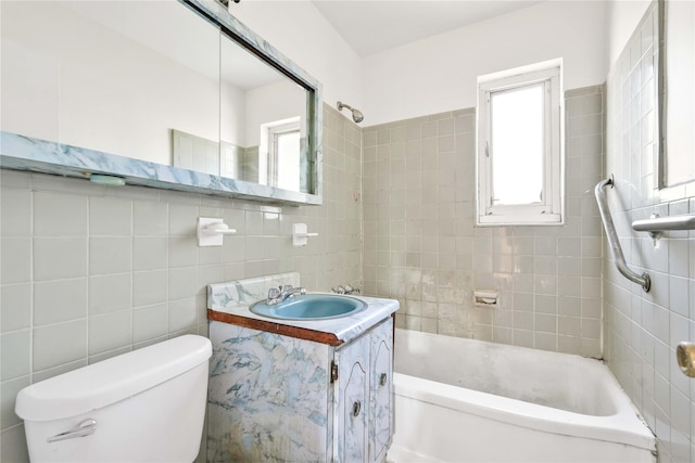 22401 Hillside Ave Unit 2, Queens Village, NY 11427 - bathroom with tile walls, vanity, and shower / tub combination