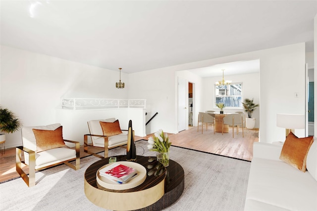 22401 Hillside Ave Unit 2, Queens Village, NY 11427 - living area featuring a chandelier and wood finished floors