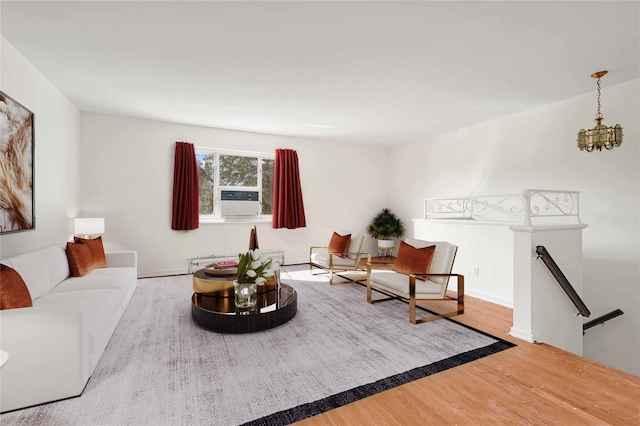 22401 Hillside Ave Unit 2, Queens Village, NY 11427 - living room with wood finished floors, cooling unit, and a chandelier