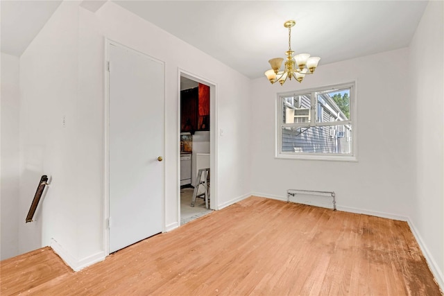 22401 Hillside Ave Unit 2, Queens Village, NY 11427 - unfurnished dining area with a chandelier and light wood-style floors