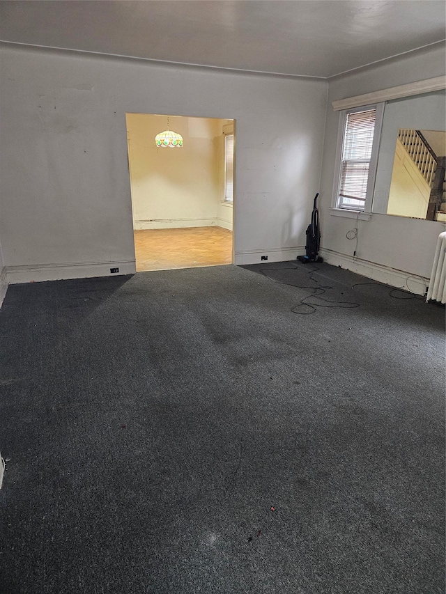 8931 184th St, Hollis, NY 11423 - carpeted spare room with baseboards