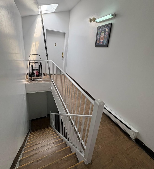 14808 35th Ave, Flushing, NY 11354 - staircase with baseboard heating, a skylight, and vaulted ceiling