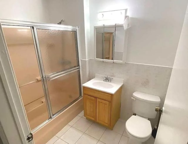 14808 35th Ave, Flushing, NY 11354 - full bath featuring vanity, tile patterned flooring, and bath / shower combo with glass door