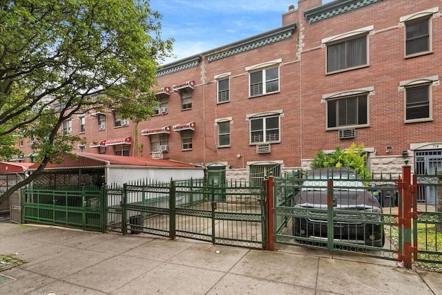 718 Garden St, Bronx, NY 10457 - view of building exterior with a fenced front yard