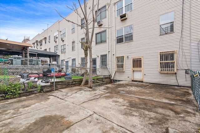 718 Garden St, Bronx, NY 10457 - rear view of house featuring a patio and cooling unit