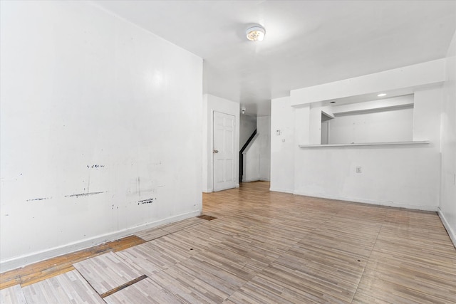 718 Garden St, Bronx, NY 10457 - empty room with wood finished floors and a smoke detector