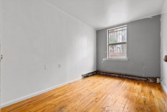 718 Garden St, Bronx, NY 10457 - unfurnished room with hardwood / wood-style floors and baseboards