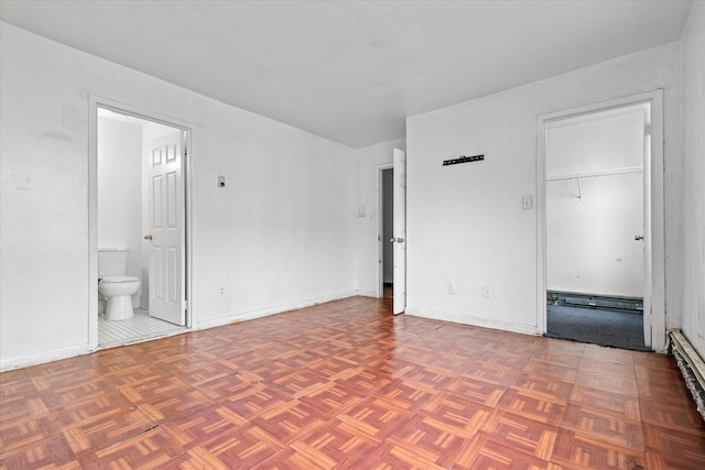 718 Garden St, Bronx, NY 10457 - unfurnished bedroom with ensuite bathroom and baseboards