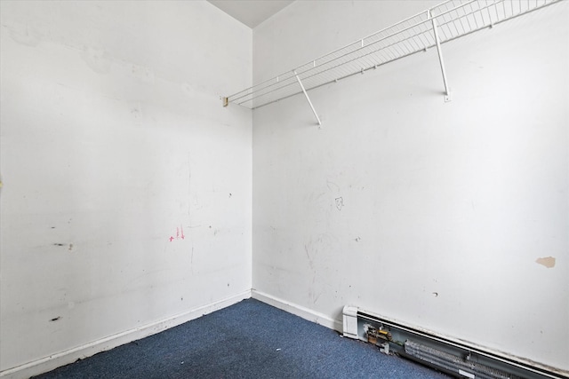 718 Garden St, Bronx, NY 10457 - spacious closet with dark carpet and a baseboard radiator