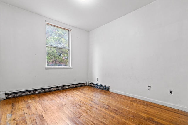 718 Garden St, Bronx, NY 10457 - unfurnished room featuring hardwood / wood-style flooring and a baseboard heating unit