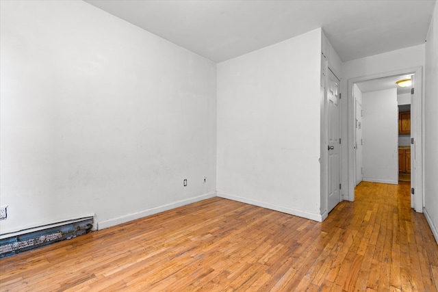 718 Garden St, Bronx, NY 10457 - unfurnished room with light wood-style flooring and baseboards
