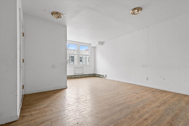 718 Garden St, Bronx, NY 10457 - spare room with hardwood / wood-style flooring and baseboards