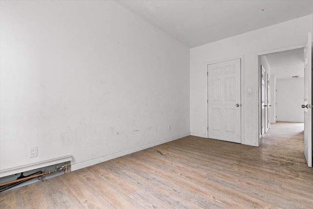 718 Garden St, Bronx, NY 10457 - empty room with wood finished floors