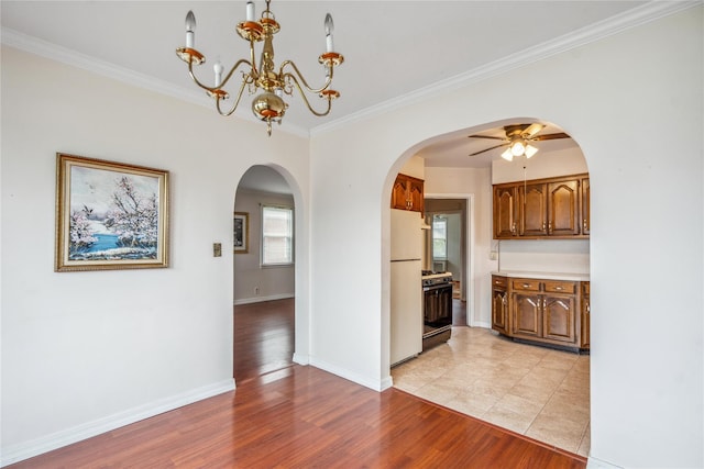 662 Benris Ave, Franklin Square, NY 11010 - kitchen featuring freestanding refrigerator, gas stove, ornamental molding, arched walkways, and ceiling fan