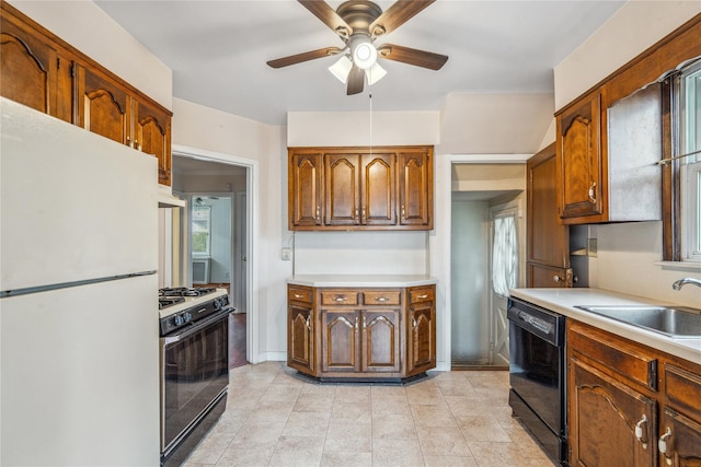 662 Benris Ave, Franklin Square, NY 11010 - kitchen with freestanding refrigerator, gas range oven, black dishwasher, a ceiling fan, and light countertops