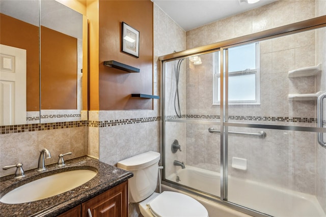 662 Benris Ave, Franklin Square, NY 11010 - bathroom with enclosed tub / shower combo, vanity, tile walls, and wainscoting