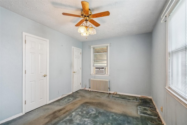 662 Benris Ave, Franklin Square, NY 11010 - carpeted spare room with radiator, cooling unit, a ceiling fan, and a textured ceiling