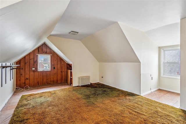 662 Benris Ave, Franklin Square, NY 11010 - bonus room featuring radiator heating unit, lofted ceiling, and wood finished floors