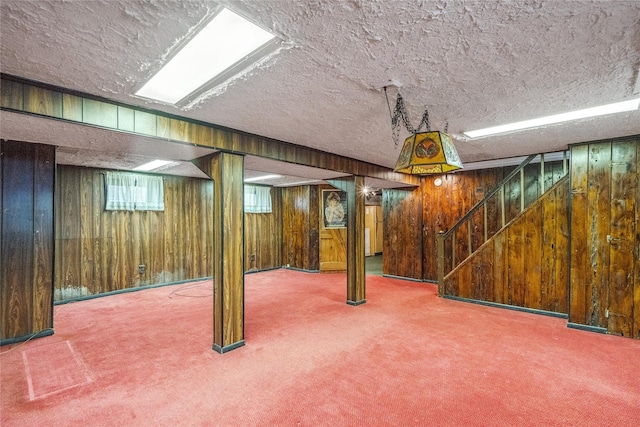 662 Benris Ave, Franklin Square, NY 11010 - basement with wood walls, carpet floors, a textured ceiling, and stairs