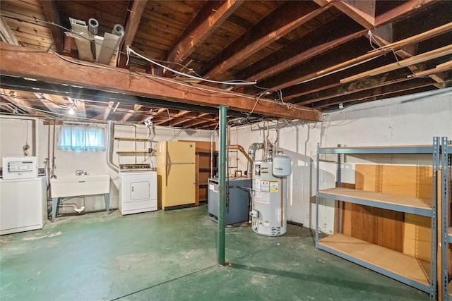 662 Benris Ave, Franklin Square, NY 11010 - below grade area with gas water heater, freestanding refrigerator, a heating unit, and washing machine and clothes dryer