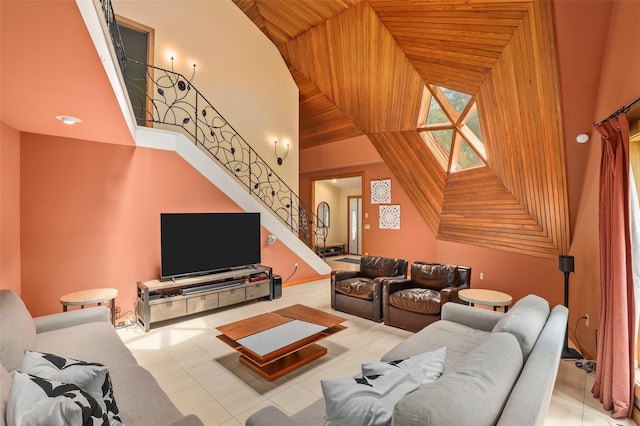 295 N Salem Rd, Waccabuc, NY 10597 - living area with stairway, tile patterned flooring, high vaulted ceiling, and wooden ceiling