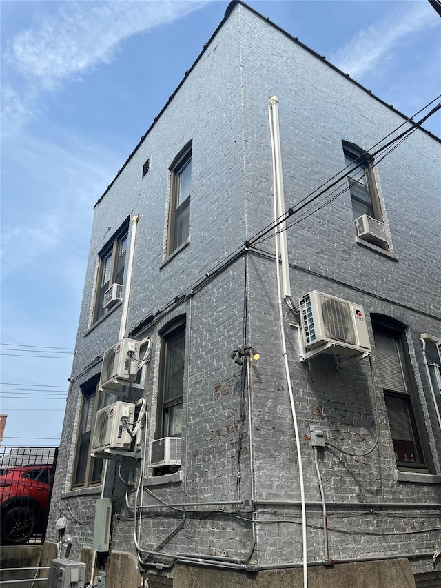 1004 Rhinelander Ave, Bronx, NY 10462 - view of home's exterior featuring brick siding and cooling unit