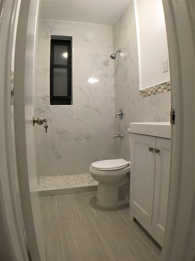 1004 Rhinelander Ave, Bronx, NY 10462 - full bathroom with tile walls, a shower stall, and vanity