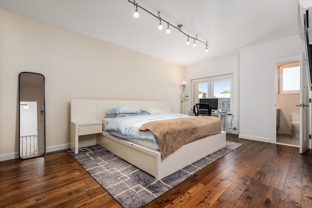 88-37 74th Ave, Glendale, NY 11385 - bedroom with rail lighting, dark wood-style flooring, access to exterior, and connected bathroom