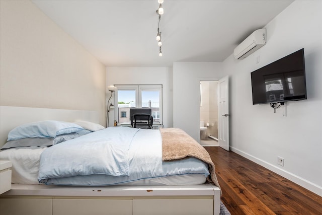 88-37 74th Ave, Glendale, NY 11385 - bedroom with a wall mounted AC, dark wood-type flooring, and ensuite bathroom