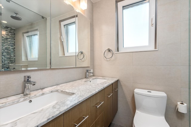 88-37 74th Ave, Glendale, NY 11385 - bathroom with tile walls, double vanity, plenty of natural light, and tasteful backsplash