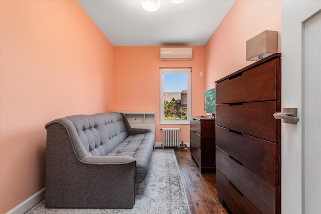 88-37 74th Ave, Glendale, NY 11385 - living area with radiator, a wall mounted AC, and dark wood-style flooring