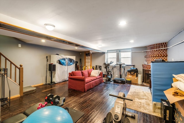 88-37 74th Ave, Glendale, NY 11385 - exercise room featuring wood-type flooring, recessed lighting, and a fireplace