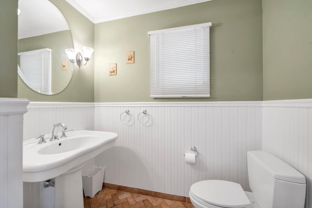 51 Highfield Ave, Port Washington, NY 11050 - bathroom featuring a wainscoted wall and ornamental molding