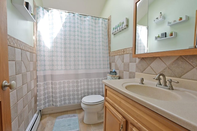 7 Amber Ln, Coram, NY 11727 - full bath featuring tile walls, vanity, a baseboard heating unit, a shower with shower curtain, and a wainscoted wall