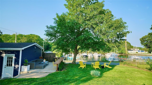 412 Atlantic Ave, Greenport, NY 11944 - view of yard featuring a water view, a patio area, and an outdoor structure