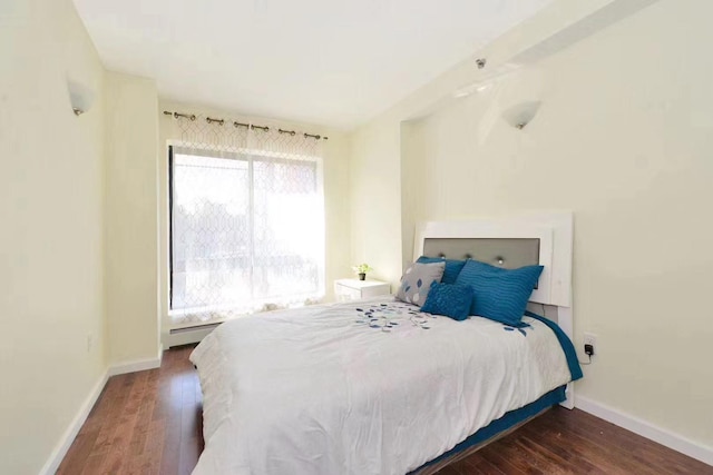 144-89 38th Ave Unit 5B, Flushing, NY 11354 - bedroom featuring dark wood finished floors and baseboard heating