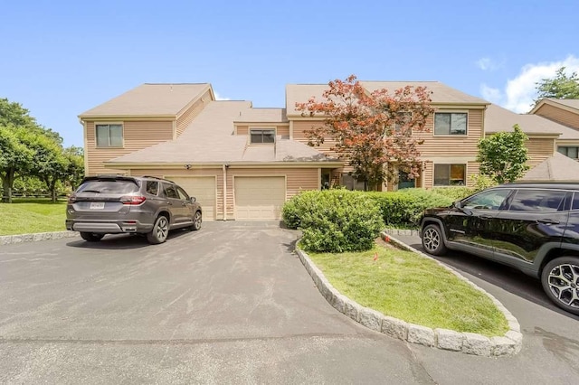 13 Bayberry Ln, Rye Brook, NY 10573 - townhome / multi-family property featuring asphalt driveway, a garage, and a front yard