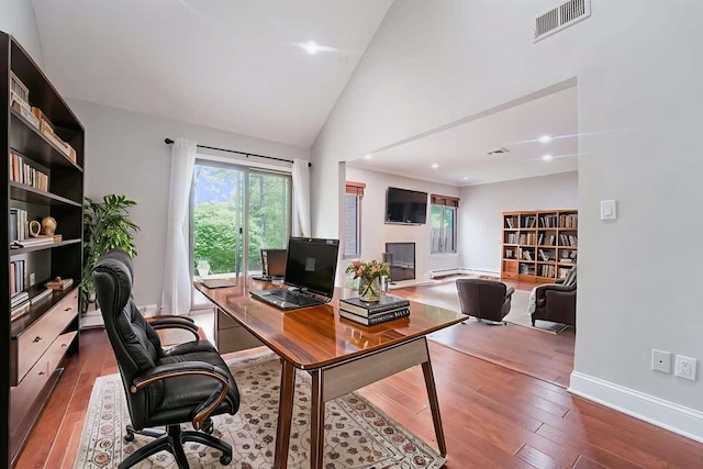 13 Bayberry Ln, Rye Brook, NY 10573 - office space with hardwood / wood-style flooring, high vaulted ceiling, and baseboard heating