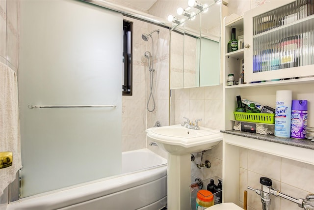 83-85 Woodhaven Blvd Unit 6F, Woodhaven, NY 11421 - full bathroom featuring tile walls, shower / bath combination, and backsplash
