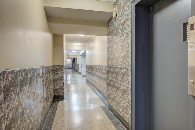 83-85 Woodhaven Blvd Unit 6F, Woodhaven, NY 11421 - hall featuring tile walls and wainscoting